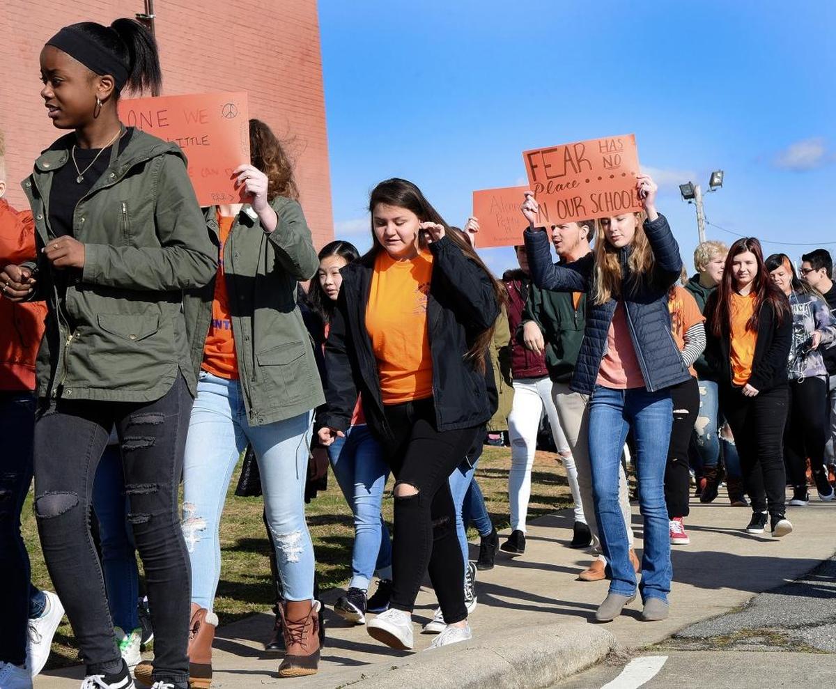 Penn-Griffin School for the Arts students take part in a "Stand for Change" demonstration against violence Wednesday on the school grounds in High Point, NC.
