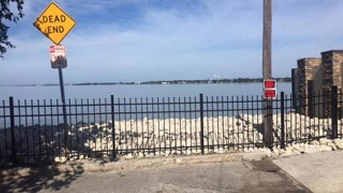 Signs posted when the Point Pleasant Point fence was installed