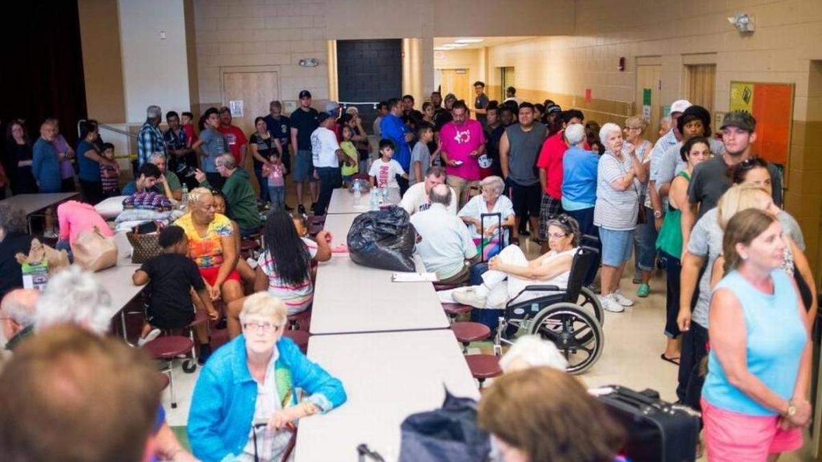 FILE: Evacuees stand in line for lunch at the Buffalo Creek Middle School shelter as Hurricane Irma slowly approaches Manatee County on the afternoon of Sept. 9 in Palmetto.
