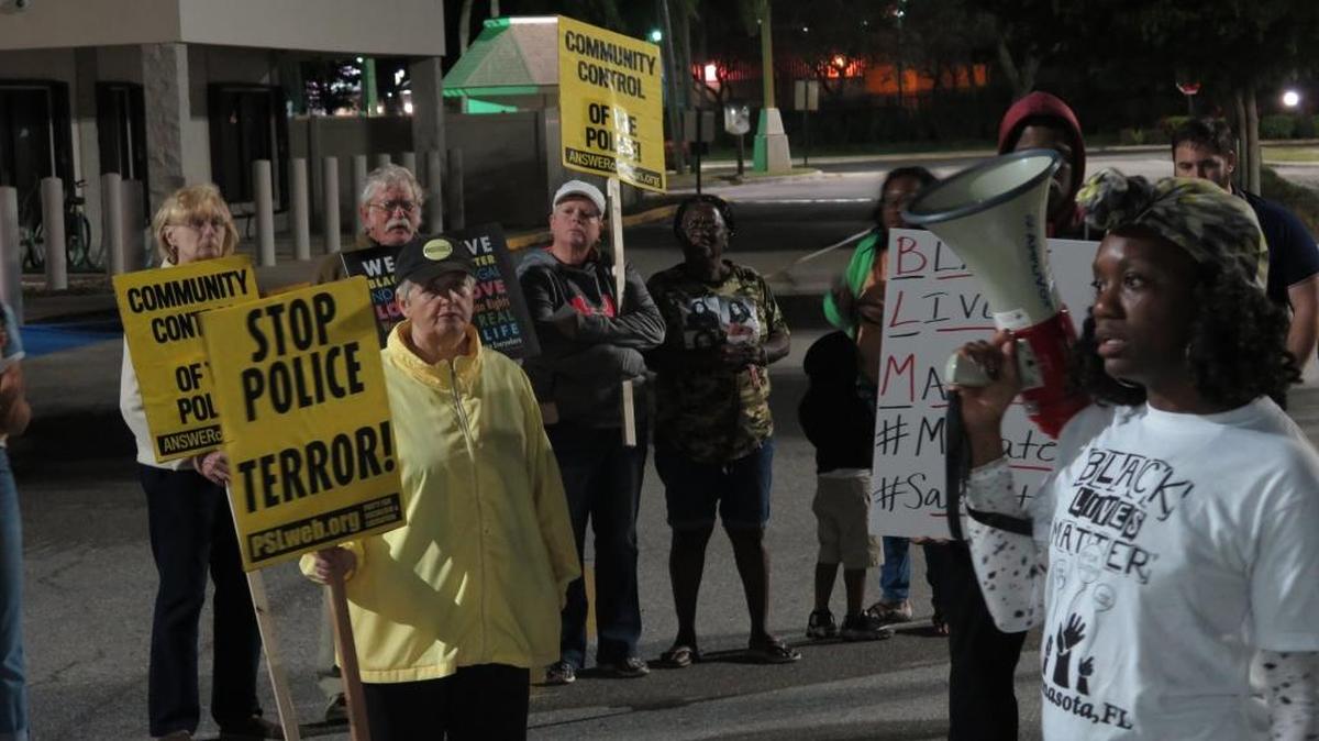 Local activist Deedra Zee, right, led a group of protesters on a march from DeSoto Square mall to the Manatee County Sheriff's Office headquarters last week in the name of Corey Mobley, who was fatally shot by a deputy Tuesday night.
