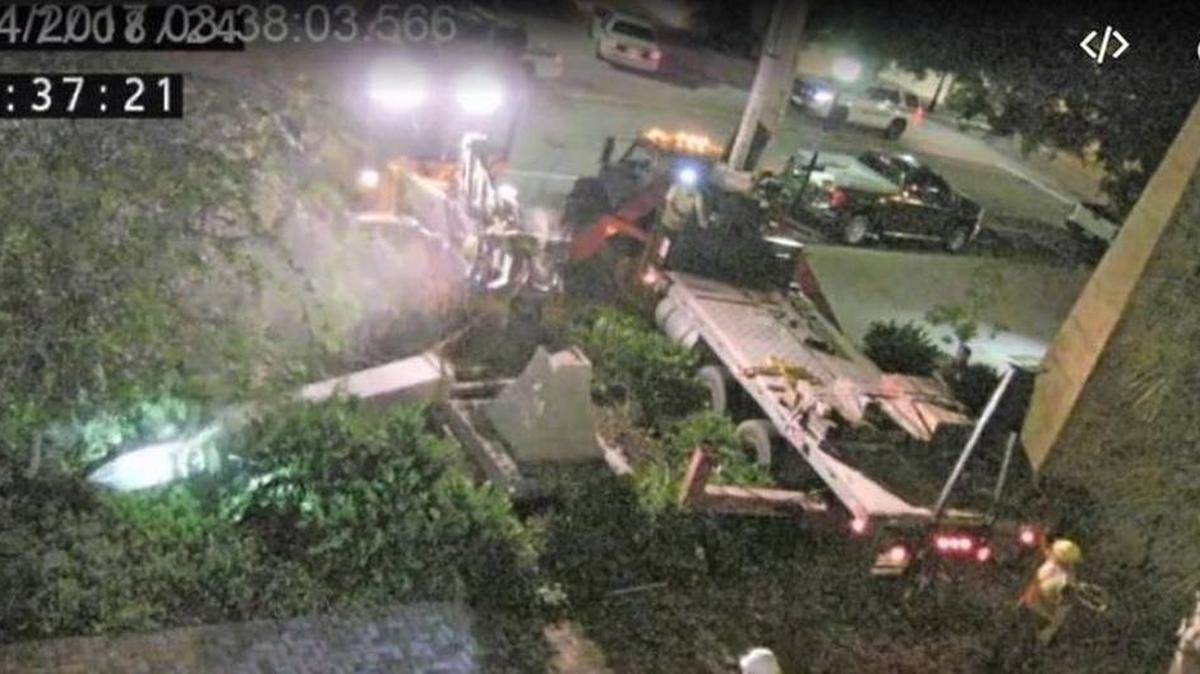 This screengrab from a video shows the moment the top portion of the Confederate monument broke and fell to the ground.