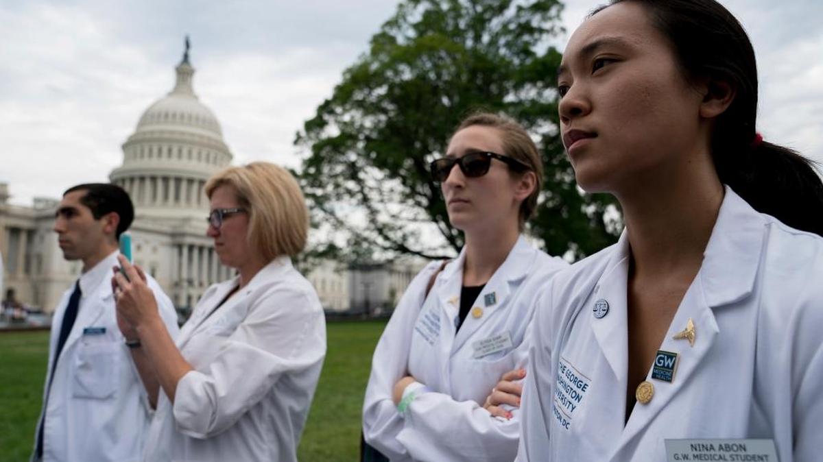Physicians and health workers join House Democrats to speak out on the impact of the Republican health care plan, Thursday on Capitol Hill in Washington.
