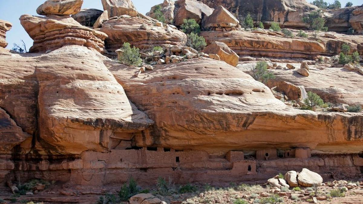 FILE - This 2016 photo shows the "Moonhouse" in McLoyd Canyon, part of Bears Ears National Monument near Blanding, Utah. President Trump's rare move to shrink two large national monuments in triggered another round of outrage among Native American leaders who vowed to unite and take the fight to court to preserve protections for lands they consider sacred. Trump decided to reduce Bears Ears by about 85 percent and Grand Staircase-Escalante by nearly half.