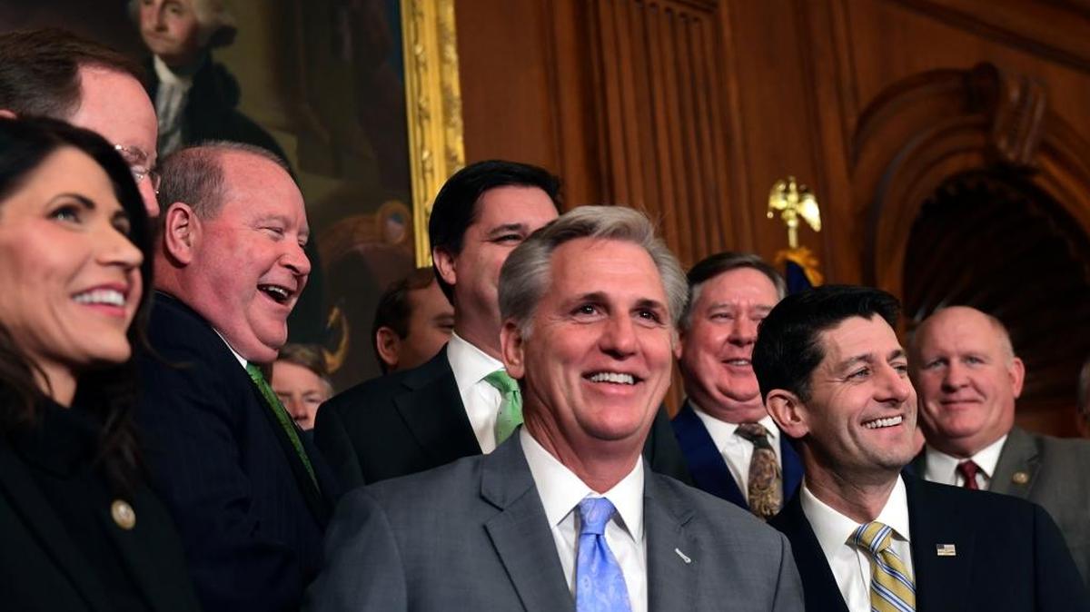 House Republicans smile before a news conference following a vote on tax reform on Capitol Hill Thursday.