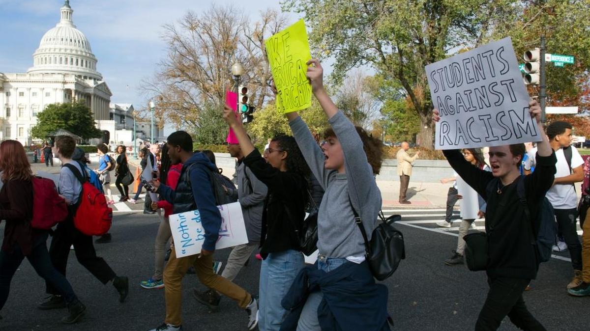 Demonstrators protesting President-elect Donald Trump walk past the Capitol in Washington on Tuesday. Hundreds of demonstrators are gathered in Washington to protest Donald Trump's election.