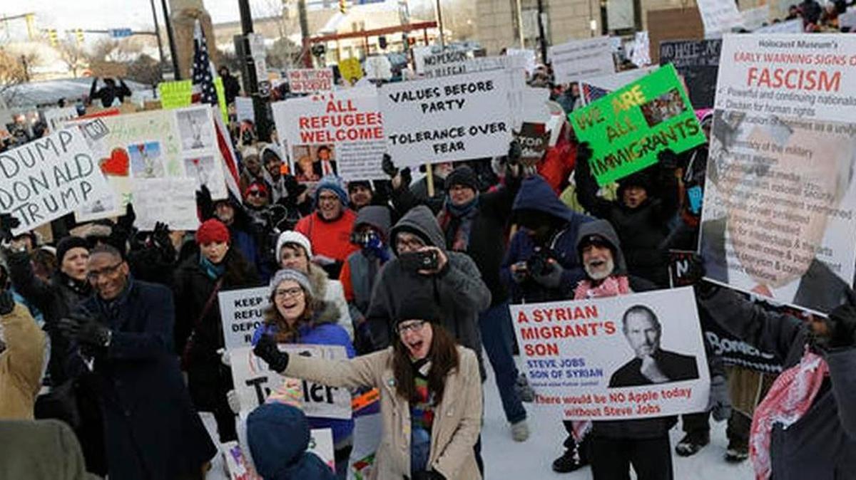 People protest at a demonstration in Market Square, Friday, Feb. 3, 2017, in Cleveland. The demonstration was organized in protest of President Donald Trump's immigration order.