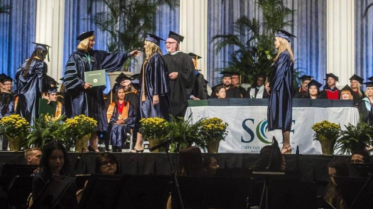 SCF President Dr. Carol F. Probstfeld hands out diplomas to graduates during State College of Florida’s spring graduation in 2017.