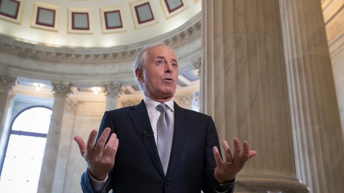 Sen. Bob Corker, R-Tenn., a member of the Senate Banking Committee, does a TV news interview about the GOP tax bill Tuesday on Capitol Hill in Washington. Corker, who's also chairman of the Senate Foreign Relations Committee and who has feuded in the past with President Donald Trump, is wavering on his support for the sweeping tax bill even as Trump heads to the Capitol today to meet with Republicans about his agenda.