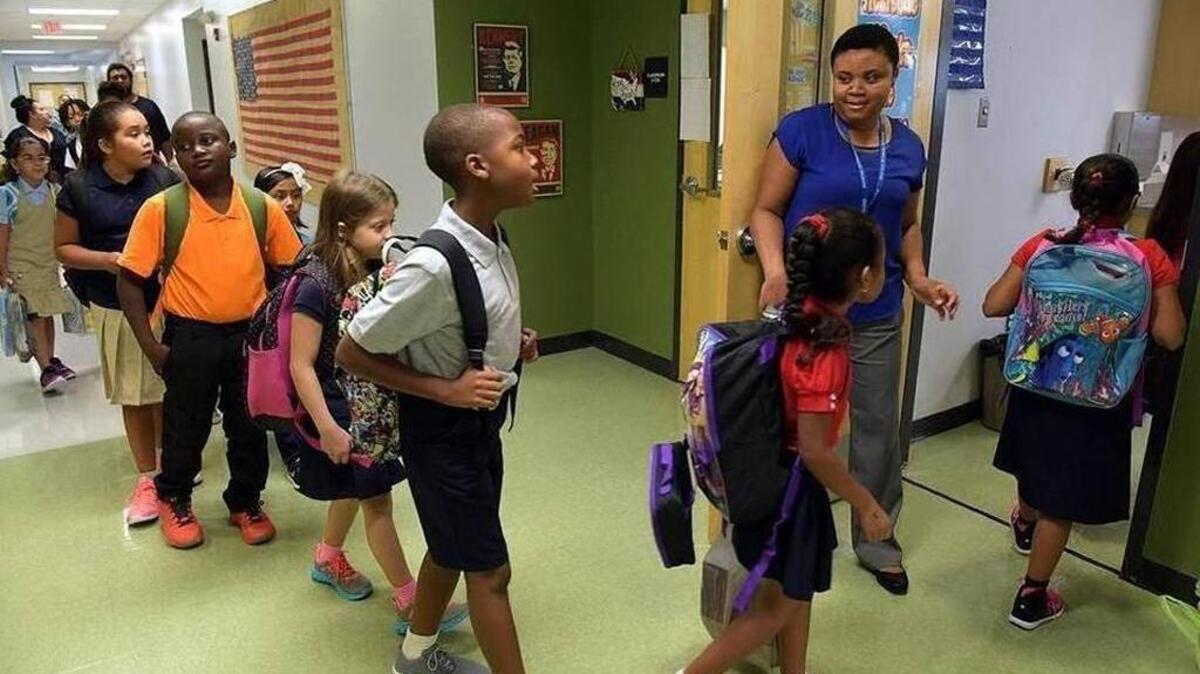 FILE: Third-graders head to their classroom at Rogers Garden-Bullock Elementary School on 2017’s first day of school in Bradenton.