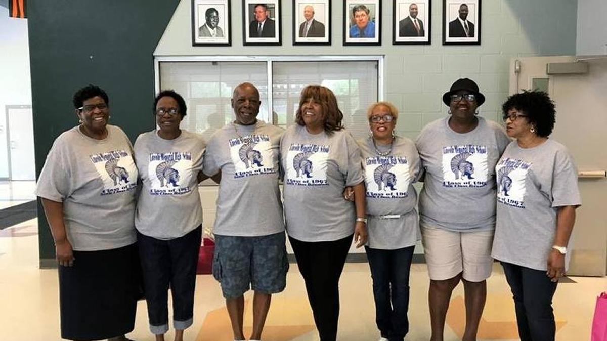 The Lincoln Memorial High School Class of 1967 has its 50th anniverary reunion this week. Among those planning to attend are, from left, Lynette Edwards, Madeline Pearson, Alex Bullock Jr., Sharon Wells Jones, Joann Thomas Surrency, Betty Lou Sailes Rhodes, and Valerie Adams Bowden. They are standing under pictures of past principals of the school.