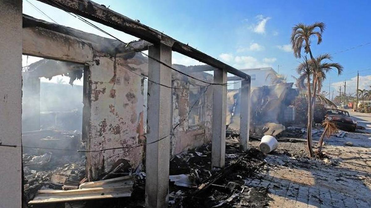 A home smolders after catching fire in the aftermath of Hurricane Irma in Marathon in the Florida Keys on Wednesday, September 13, 2017.