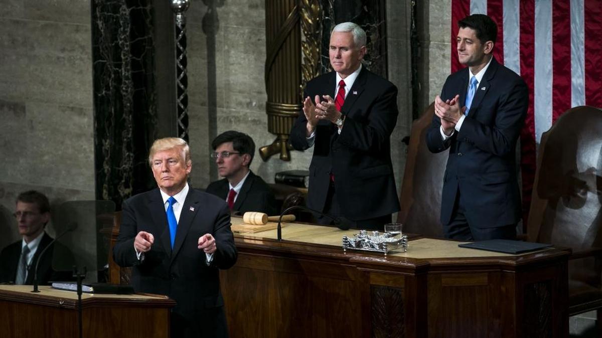 President Donald Trump (left) gestures while delivering a State of the Union address to a joint session of Congress at the U.S. Capitol in Washington on Jan. 30, 2018.