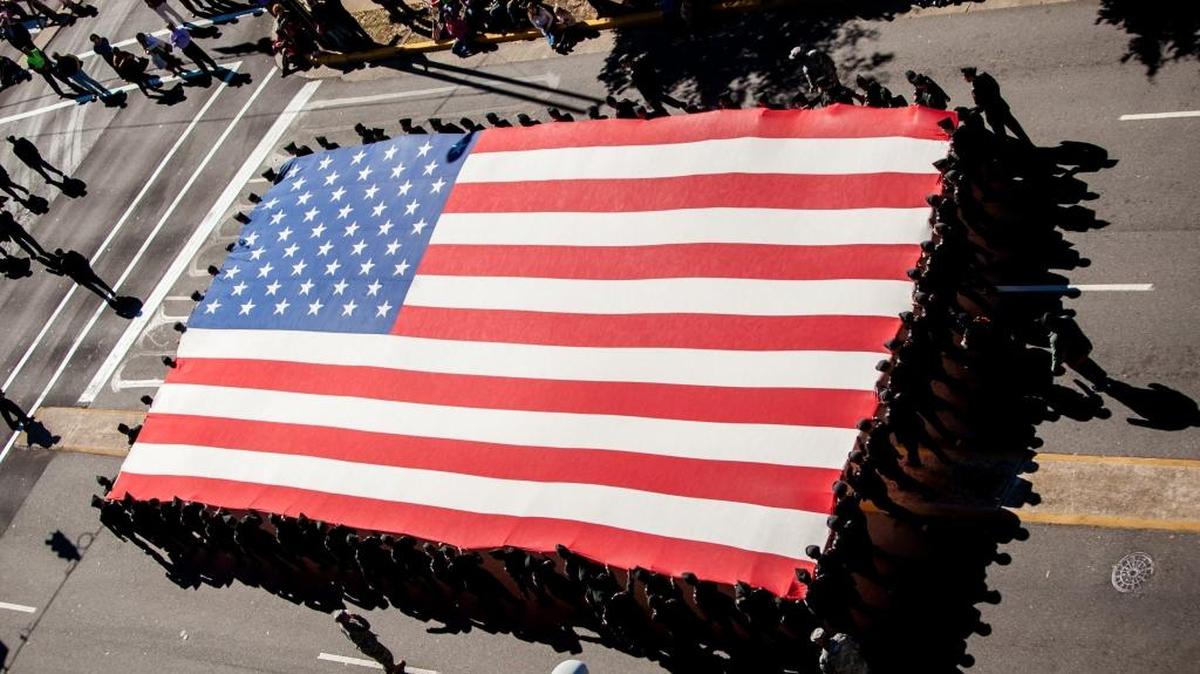 FILE: A huge American flag is carried down Sumter Street during the Annual Veterans Day Parade in Columbia, S.C.