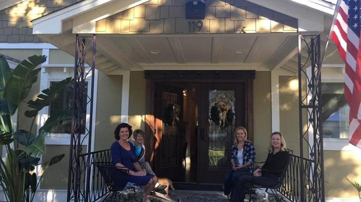 FILE: Guests relax on the front porch of Bill and Sandy Law’s “Old Florida” bungalo-style Bradenton home, which was on the 2017 Entre Nous Holiday Tour of Homes.