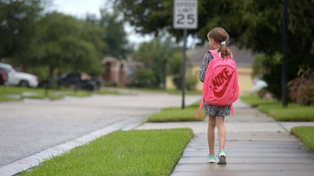 FILE PHOTO: Lyla Gallo, 7, was panicked when a bus driver dropped her off more than a mile from home during a thunderstorm last week. Here, she walks near her home in Parrish.