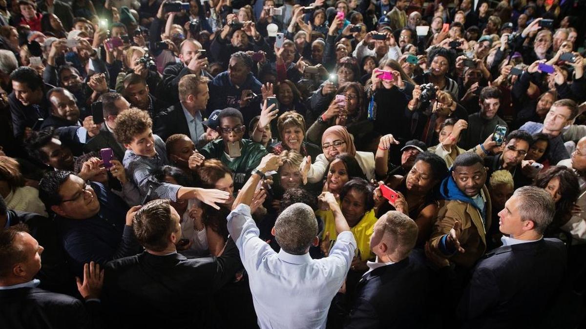 FILE - In this Saturday, Nov. 1, 2014 file photo, President Barack Obama, center, greets supporters at a campaign event for U.S. Senate candidate Gary Peters and gubernatorial candidate Mark Schauer at Wayne State University in Detroit, Mich.