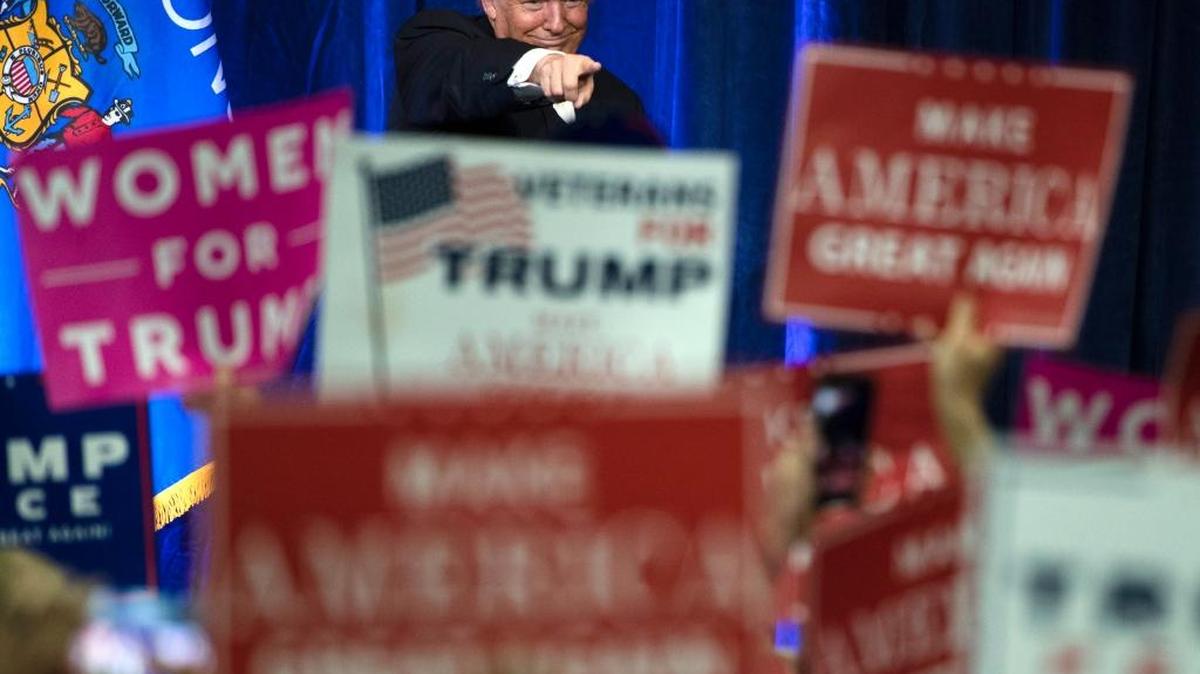 FILE - Then-Republican presidential candidate Donald Trump gestures during a campaign state Nov. 1 at the University of Wisconsin-Eau Claire in Eau Claire, Wis. In his victory speech, Trump called them America’s forgotten men and women, the workers from the coalfields of Appalachia to the hallowing manufacturing towns of the Rust Belt. They felt left behind by progress, laughed at by the elite, and so put their faith in the billionaire businessman with a sharp tongue and short temper.