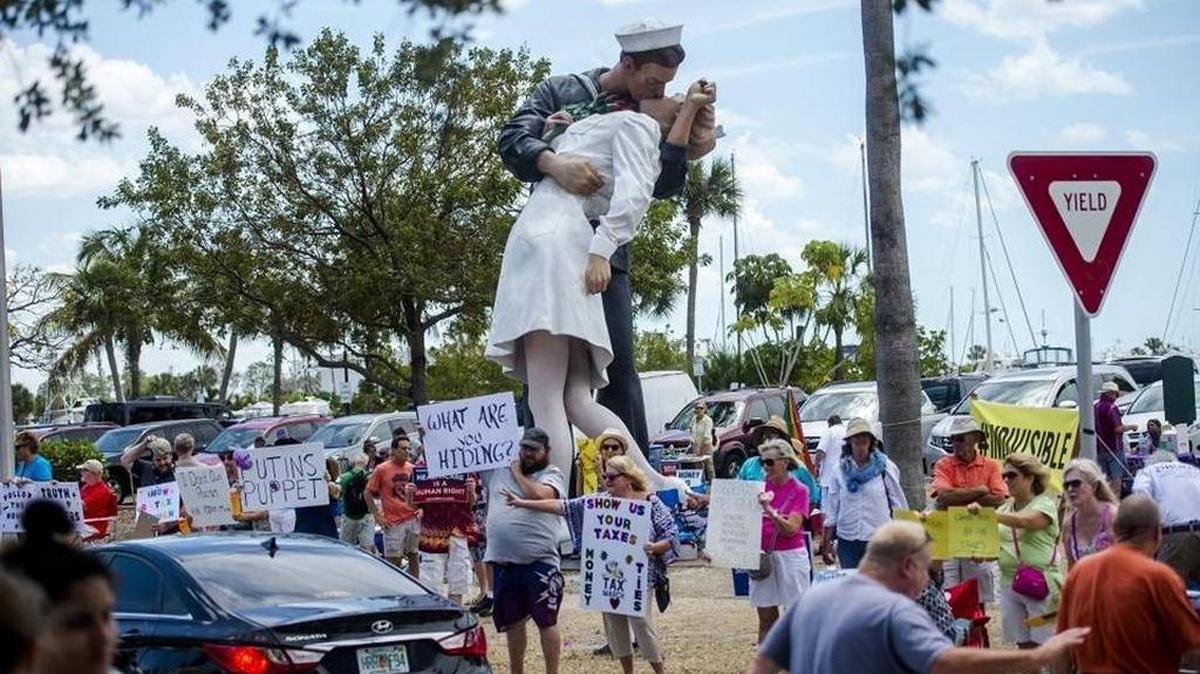 Dozens of protestors gather Saturday during "The Truth Matters March," a protest for President Donald Trump to release his tax returns and a call for honesty in The White House at the Unconditional Surrender Statue in downtown Sarasota.
