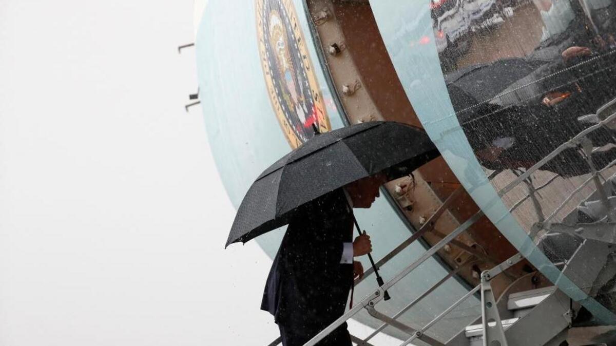 President Donald Trump boards Air Force One before departing from a rainy Andrews Air Force Base, Md., Thursday, April 6, 2017. Trump is going to Mar-a-Largo for a meeting with Chinese President Xi Jinping.