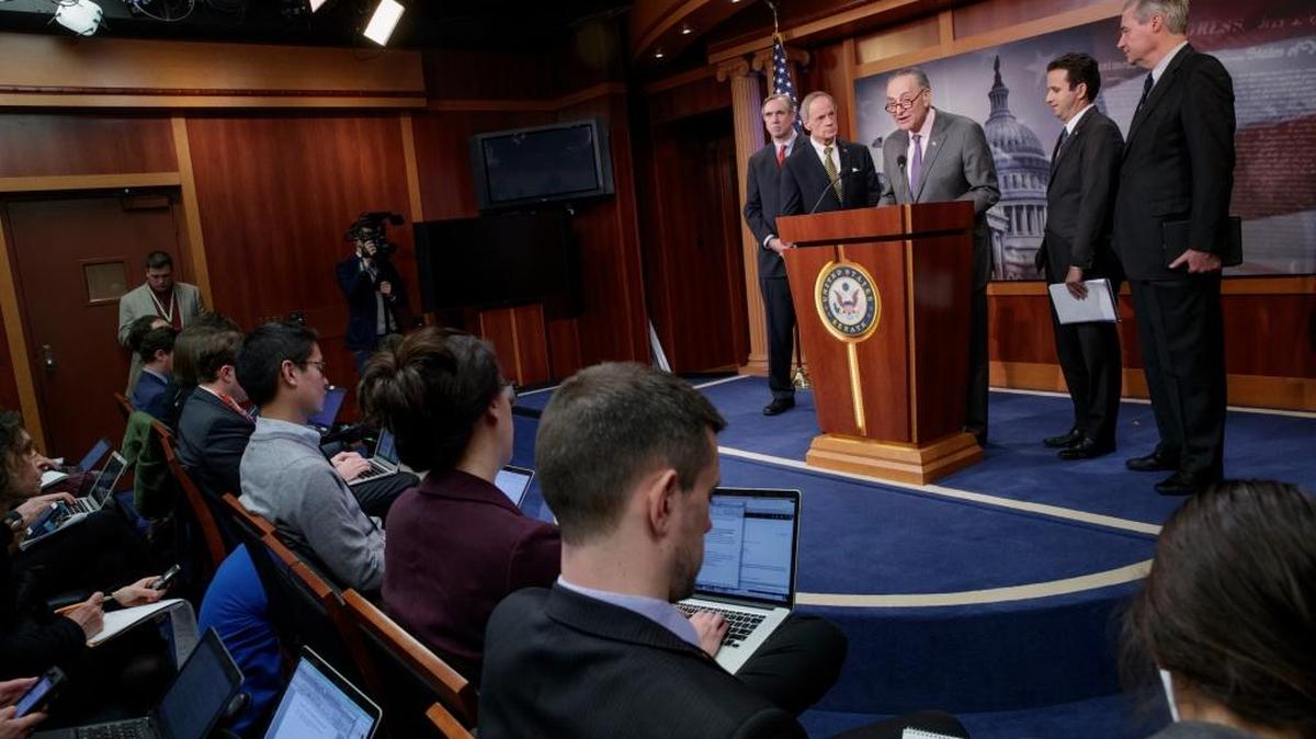 Senate Democrats, from left, Sen. Jeff Merkley, D-Ore., Sen. Tom Carper, D-Del., Minority Leader Chuck Schumer of N.Y., Sen. Brian Schatz, D-Hawaii, and Sen. Sheldon Whitehouse, D-R.I., participate in a news conference on Capitol Hill in Washington, Friday, announcing their request of the Republican majority to delay the confirmation vote on President Donald Trump's controversial nominee to lead the Environmental Protection Agency, Scott Pruitt, until the nominee turns over the thousands of requested emails from his time as attorney general of Oklahoma.