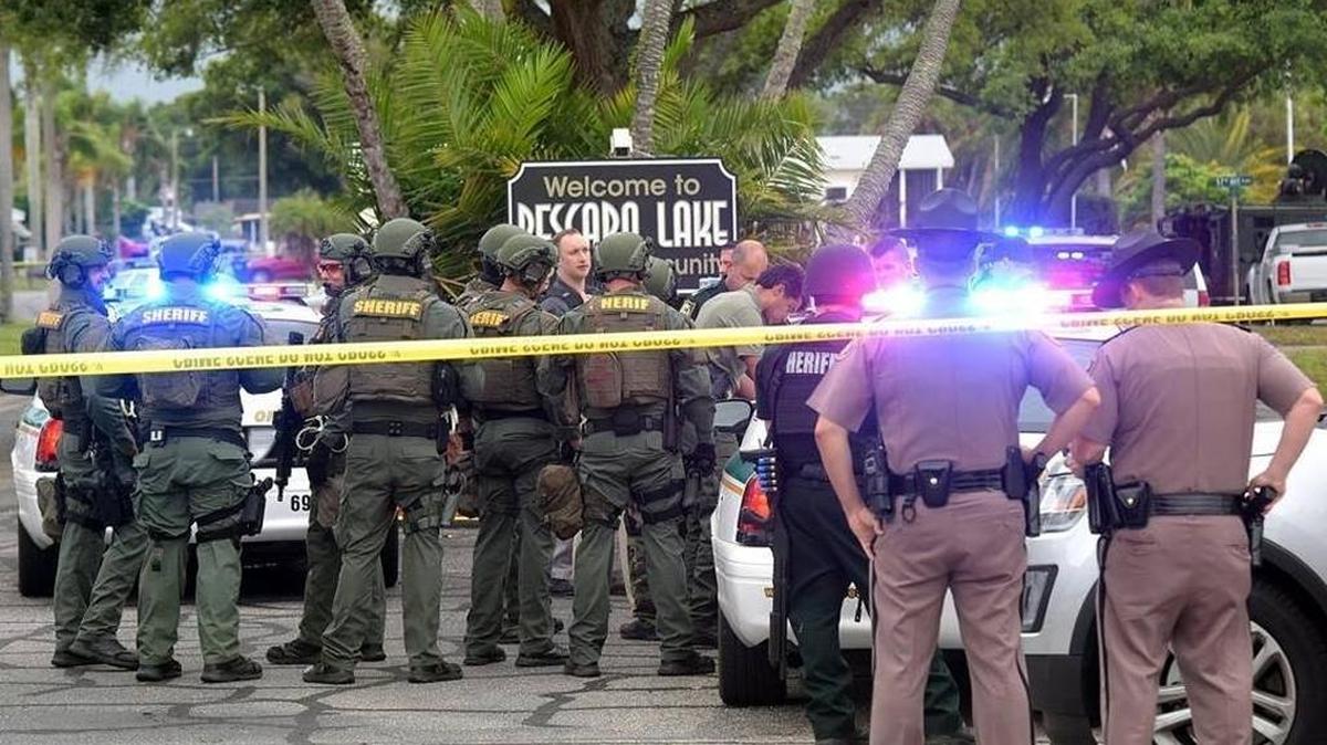 FILE PHOTO: Manatee County Sheriff's SWAT members gather at the entrance of Pescara Lake April 6, 2017, in response to a man who took another man hostage in Bradenton. The man was shot to death after he opened fire on deputies after a six hour standoff.