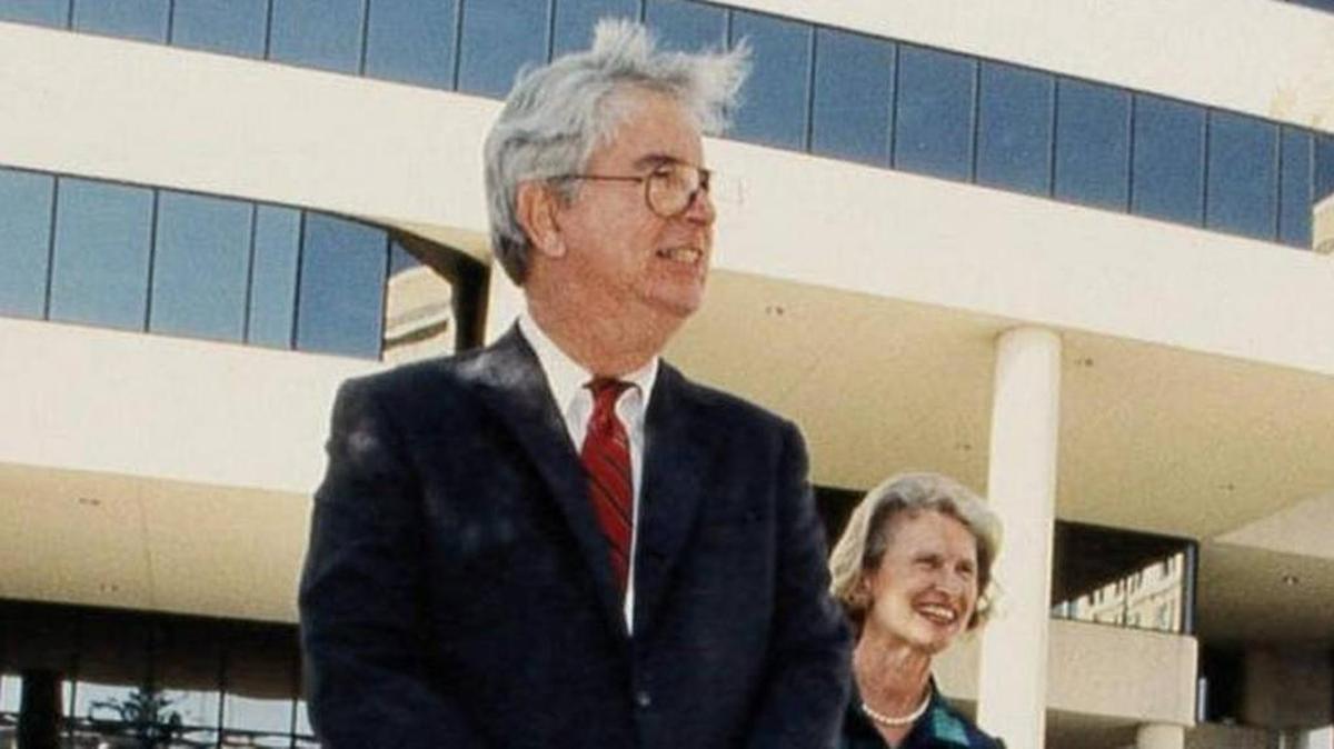 Dan Blalock, left, stands proudly after winning the Manatee County Distinguished Citizen Award in 1992 as his second wife, Paddy, looks on.