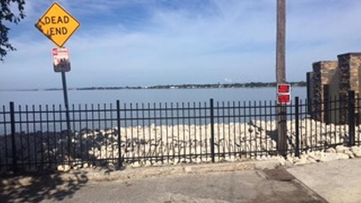 Signs posted when the Point Pleasant Point fence was installed