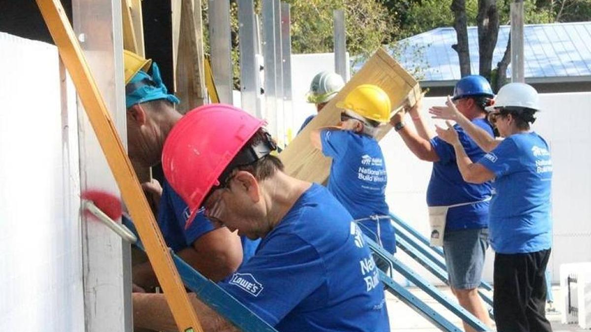 Up goes a casing for a door at a Habitat for Humanity construction site on May 11, 2017, in Manatee County.