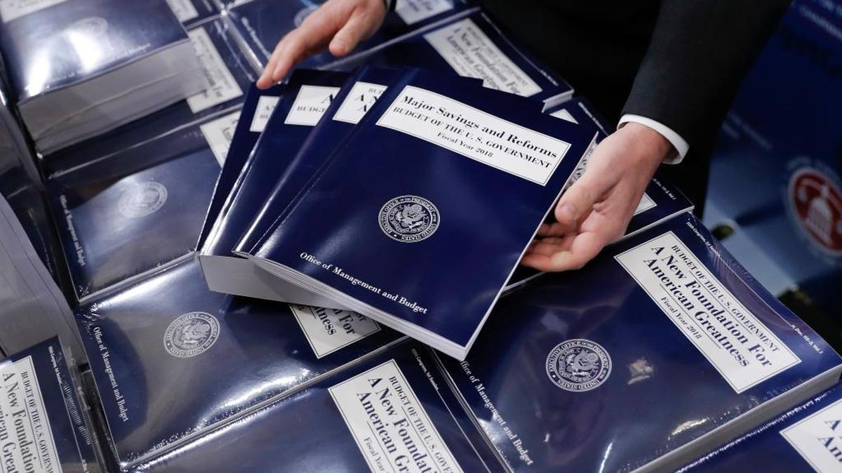 FILE - In this May 23, 2017 file photo, copies of President Donald Trump's fiscal 2018 federal budget are seen on Capitol Hill in Washington.