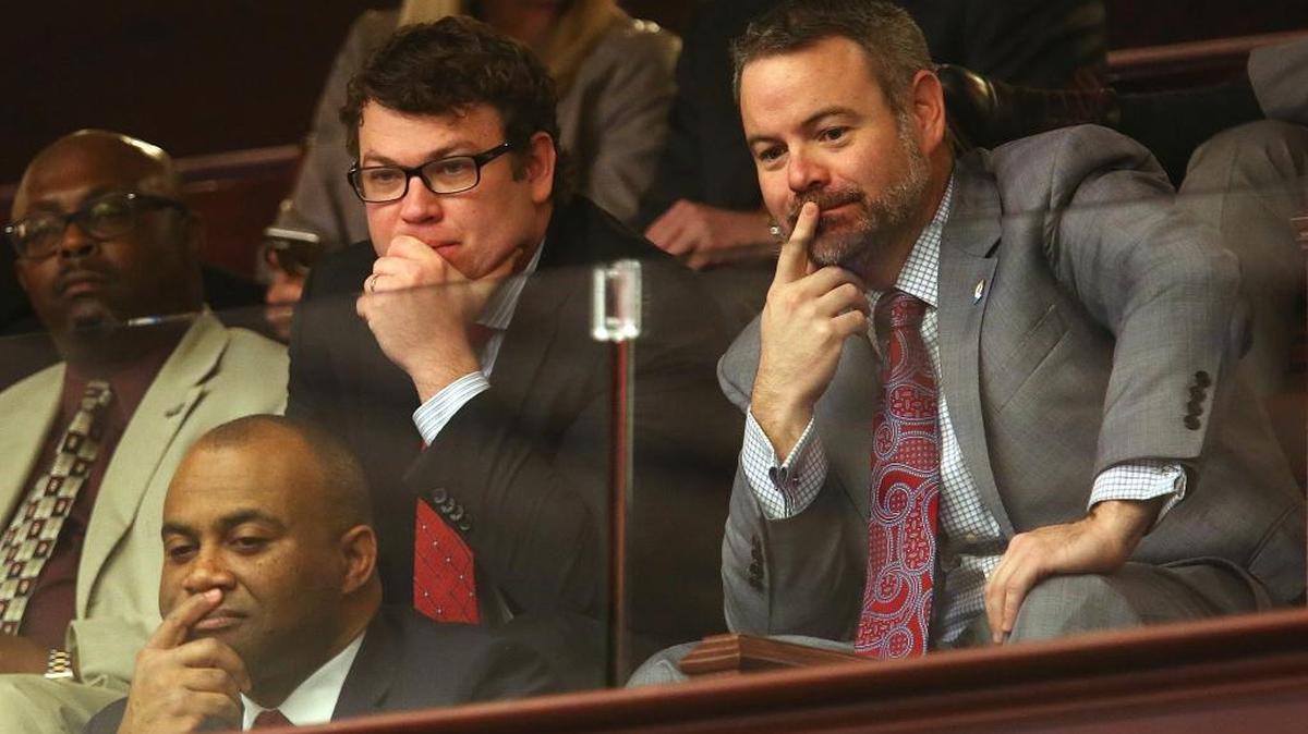 FILE: Front left- Kenneth Lawson, CEO of Visit Florida, Mike Grissom, interim chief of Enterprise Florida, right, and John Tupps, Vice President of Government Relations, Visit Florida, top left, watch debate on Visit Florida.