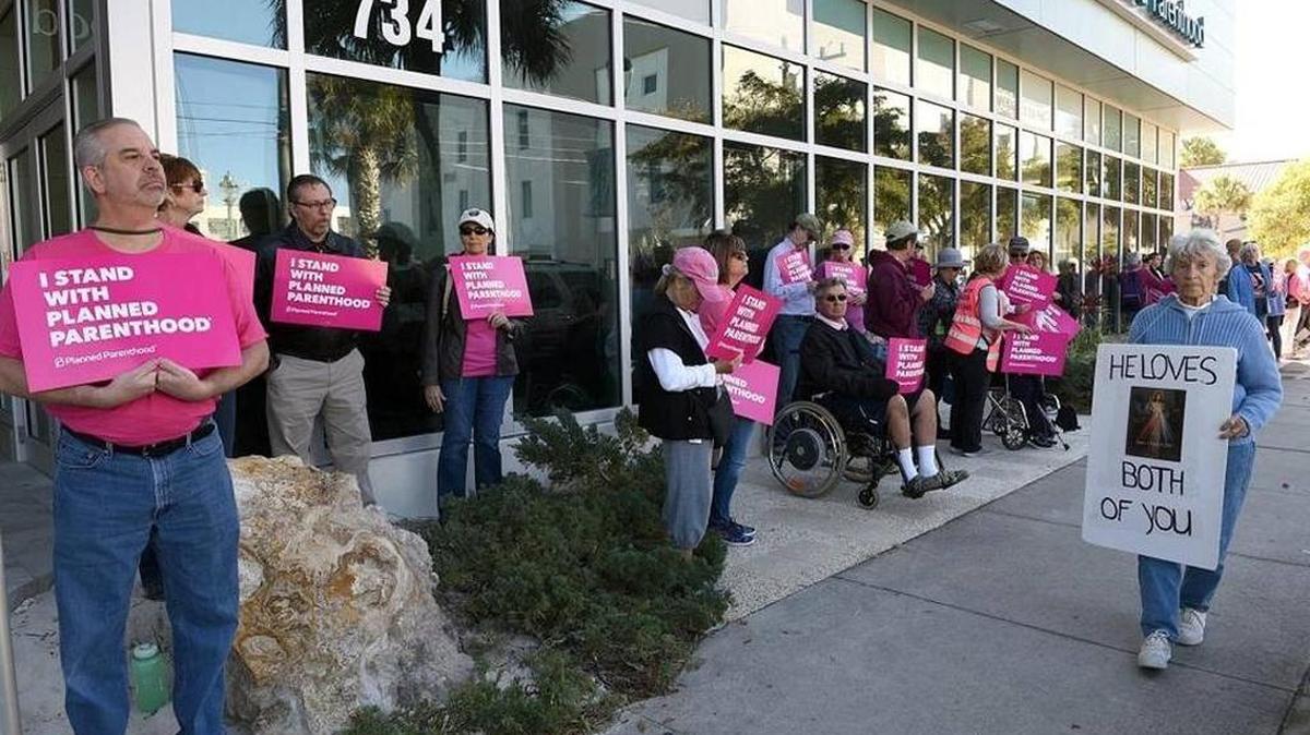 FILE: Supporters of Planned Parenthood stood in solidarity Feb. 10, 2017, outside the Sarasota clinic, outnumbering protestors who want to defend the organization a day ahead of the protests planned across the country.