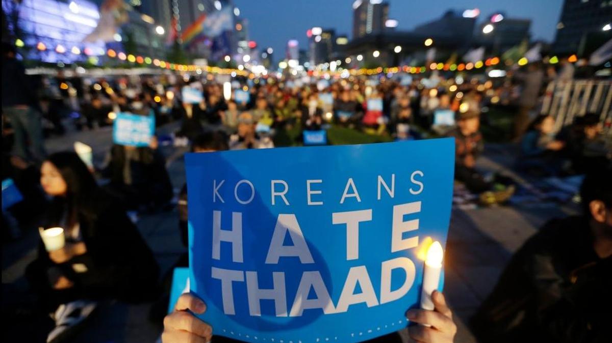 FILE - In this April 29, 2017, file photo, South Korean protesters stage a rally to oppose a plan to deploy the advanced U.S. missile defense system called Terminal High Altitude Area Defense, or THAAD, near U.S. Embassy in Seoul, South Korea.