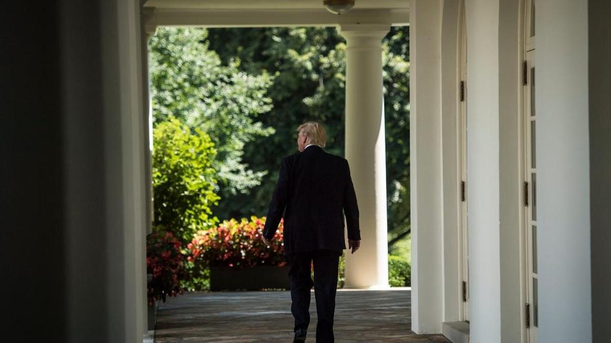 President Donald Trump, seen Wednesday, tweeted his decision to ban transgender people from the military, citing higher medical costs and the "disruption" transgender troops "would entail."