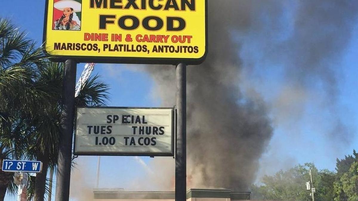 FILE PHOTO: Smoke rises March 16 from the roof of Restaurante La Rancherita on Eighth Avenue West in Palmetto.