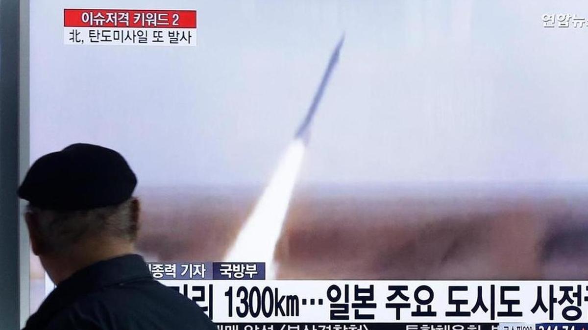 A man watches a TV screen showing a file footage of the missile launch conducted by North Korea, at Seoul Railway Station in Seoul, South Korea, Friday, March 18, 2016. The letters on the screen read "The missile puts all of South Korea and part of Japan within striking distance."