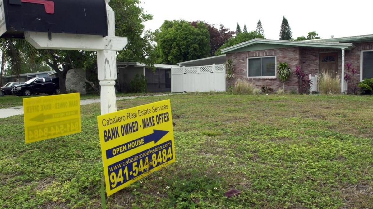 A foreclosed home in Bayshore Gardens is offered for sale in this May 2008, file photograph.