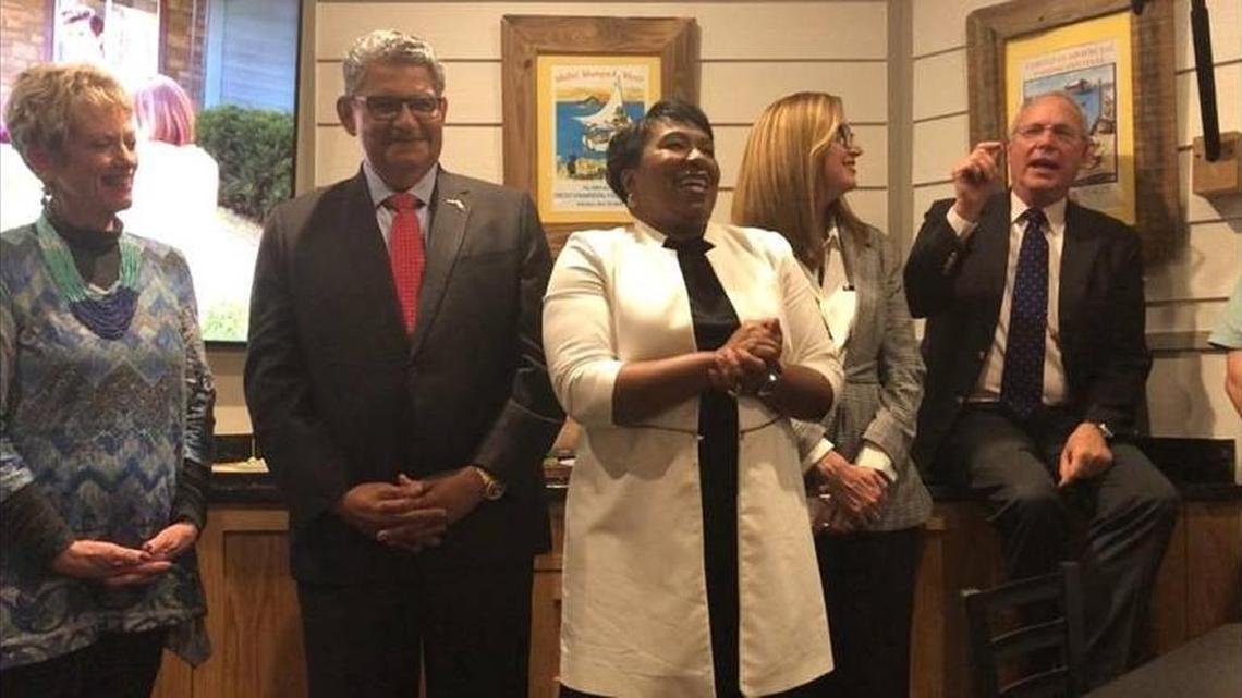 School district Superintendent Diana Greene, center, celebrates the passage Tuesday night of the one-mill tax referendum with, from left: Linda Agresta, retired educator and former school board member; John Colon, school board member; Cynthia Saunders, school district deputy superintendent of instructional services; and Pat Neal, local real estate developer.
