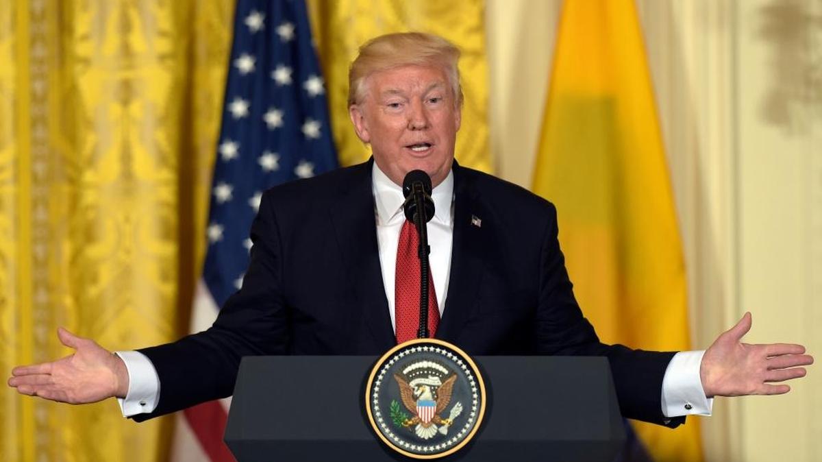 FILE - In this May 18, 2017 file photo, President Donald Trump speaks in the East Room of the White House in Washington. Trump’s attorneys originally wanted him to submit an updated financial disclosure without certifying the information as true, according to correspondence with the Office of Government Ethics.