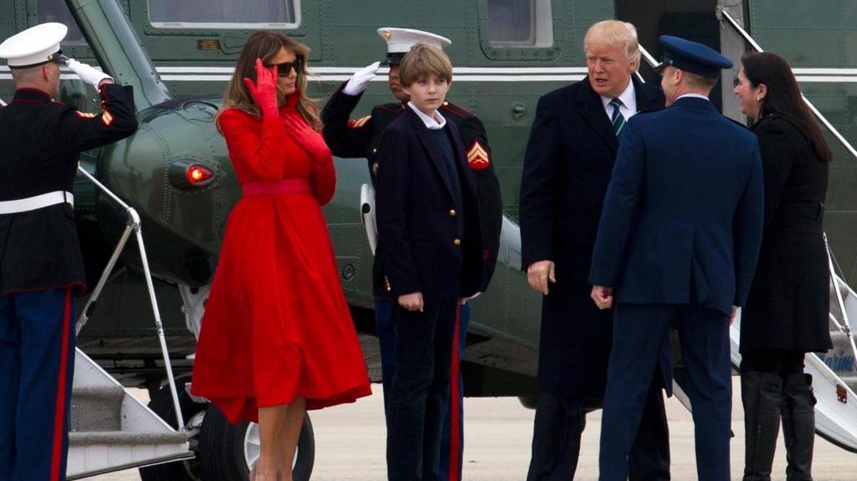 President Donald Trump, accompanied by first lady Melania Trump, and their son Barron, steps off from Marine One upon their arrival at Andrews Air Force Base, Md., on Friday, March 17, 2017, en route to Palm Beach.