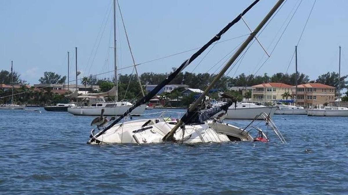 A boat is partially sunk in the Intracoastal Waterway by Cortez in this 2016 Herald file photo. The boat is an example of issues surrounding derelict and abandoned boats in Manatee County.