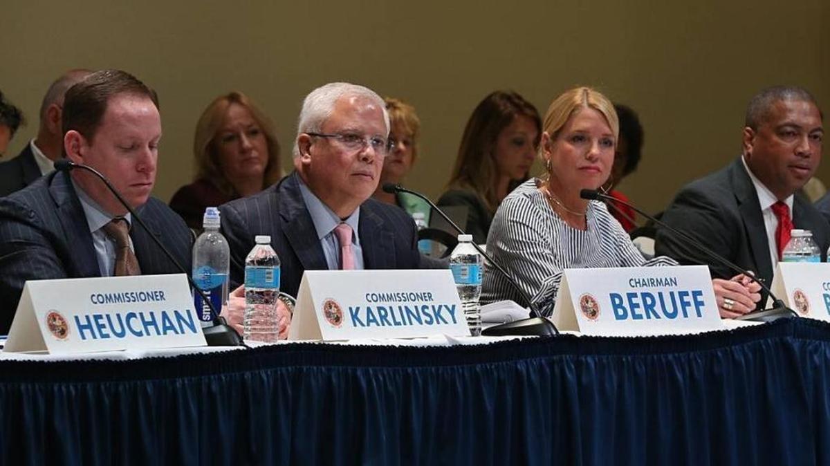 Chairman Carlos Beruff, center, is flanked by Commissioner Fred Karlinsky and Attorney General Pam Bondi as members of the Constitutional Revision Commission listen to residents during a town hall meeting with at Florida International University in Miami, April 6, 2017.