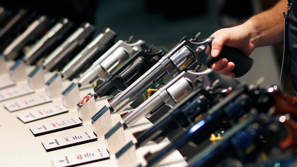 FILE - Handguns are displayed at the Smith & Wesson booth at the 2016 Shooting, Hunting and Outdoor Trade Show in Las Vegas.