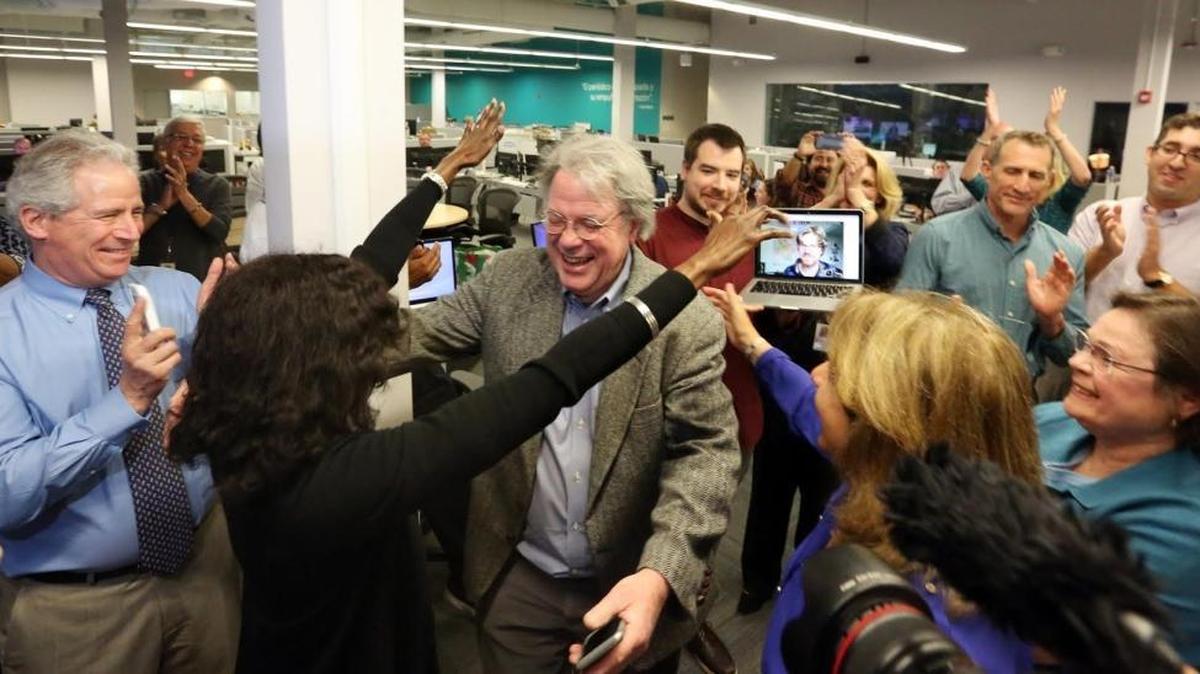 The Miami Herald newsroom reacts to the the second of two Pulitzer Prize awards announced on Monday, April 10, 2017. Nancy Ancrum, Editorial Page Editor, reaches to give Jim Morin, political cartoonist, a hug for his second career Pulitzer. Staff coverage of the Panama Papers, the international investigation that exposed how crooks and millionaires use the secret world of offshore companies, and the mordant political commentary of editorial cartoonist Jim Morin in a year rife with material won the Miami Herald two Pulitzer Prizes. The prize went to Morin and Panama Papers reporter Nicholas Nehamas and a second Panama Papers reporter, South America correspondent Jim Wyss, was patched in on video via Skype from Bogota.