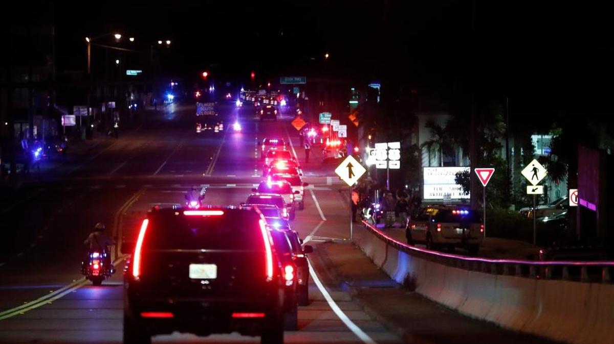 President-elect Donald Trump's motorcade is greeted by supporters along the route, Tuesday, Nov. 22, 2016, in Palm Beach as the president-elect travels to his Mar-a-Lago resort for Thanksgiving.