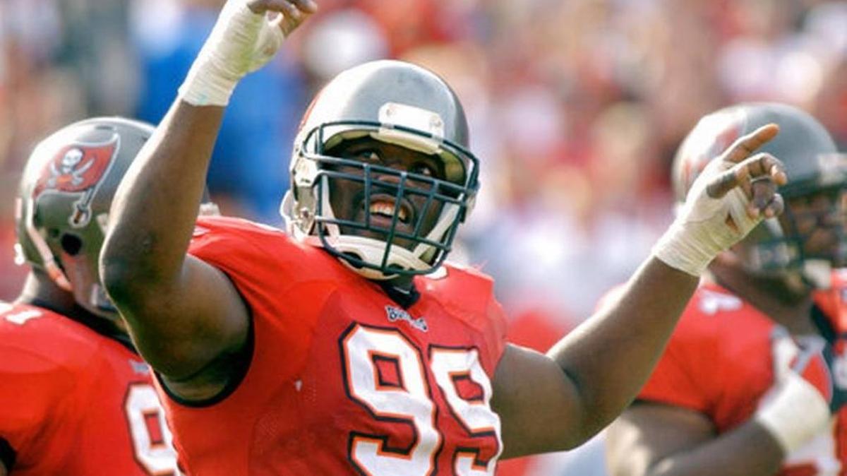 FILE - In this Jan. 12, 2003, file photo, Tampa Bay Buccaneers' Warren Sapp tries to get the crowd going during the third quarter of the NFC divisional NFL football playoff game against the San Francisco 49ers in Tampa.