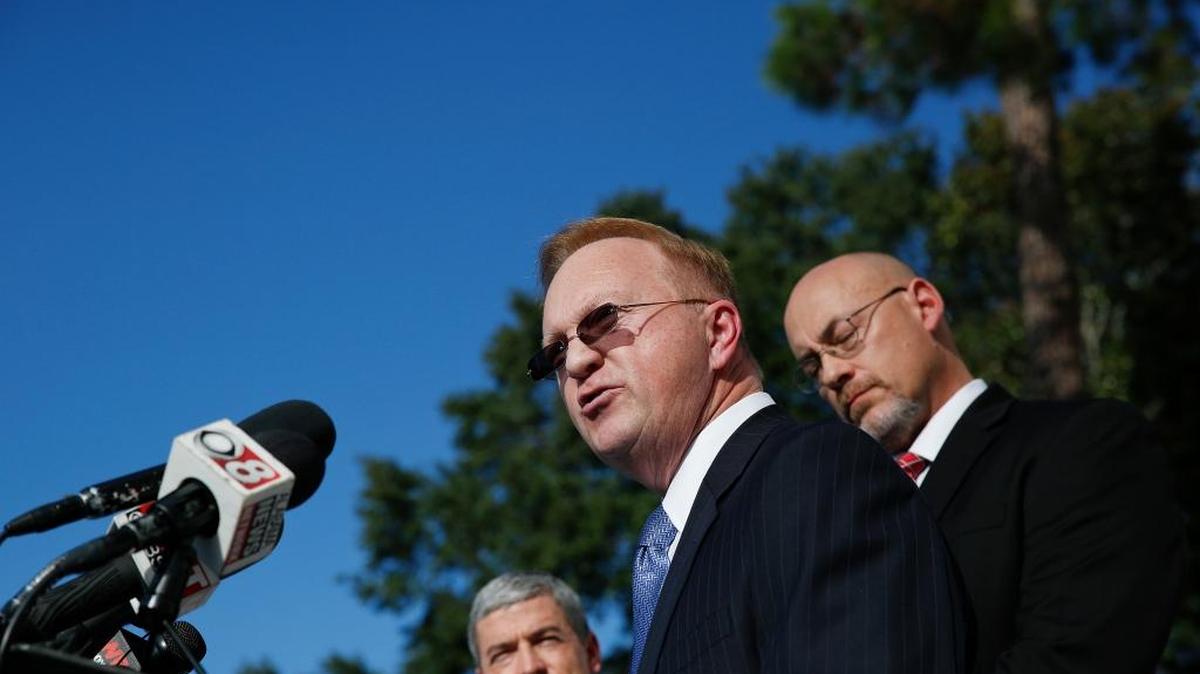 Stan Cooke, center, a member of former Alabama Chief Justice and U.S. Senate candidate Roy Moore's campaign, speaks at a news conference Tuesday in Montgomery, Ala.