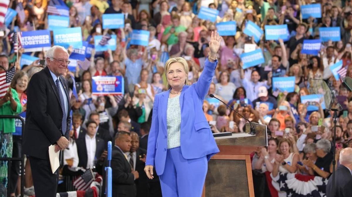 Hillary Clinton greets the crowd along with Sen. Bernie Sanders during an event where she was endorsed by Sanders at Portsmouth High School on Tuesday, July 12, 2016 in Portsmouth, N.H.