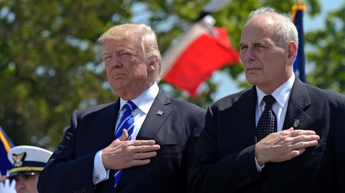 In this May 17, 2017, file photo, President Donald Trump and Homeland Security Secretary John Kelly listen to the national anthem during commencement exercises at the U.S. Coast Guard Academy in New London, Conn. Trump moved July 28 to overhaul his senior team, installing Kelly as White House chief of staff.