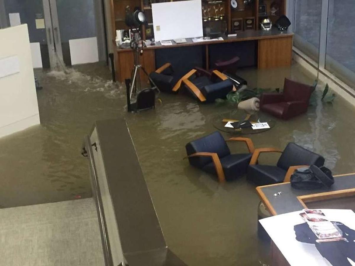 Office chairs sit in flood waters inside the KHOU offices during Hurricane Harvey, Sunday, Aug. 27.