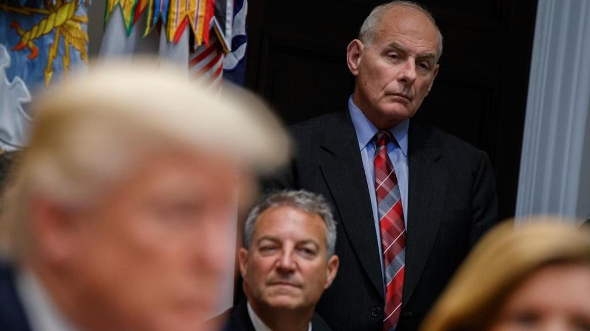 White House chief of staff John Kelly listens as President Trump speaks during a meeting in the Roosevelt Room of the White House, Tuesday, Oct. 31.